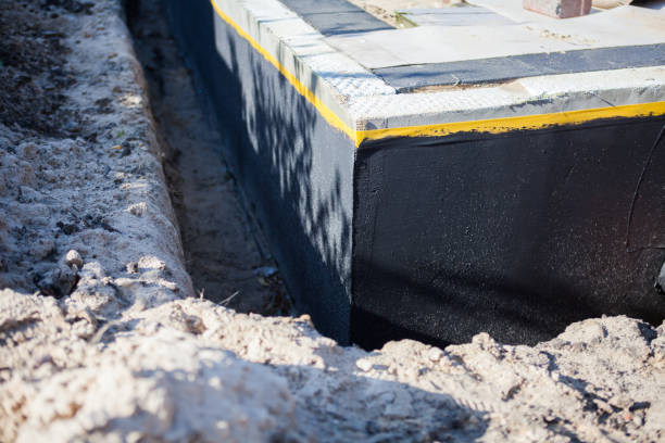 Professional Waterproofing technician working in Mogadore, OH